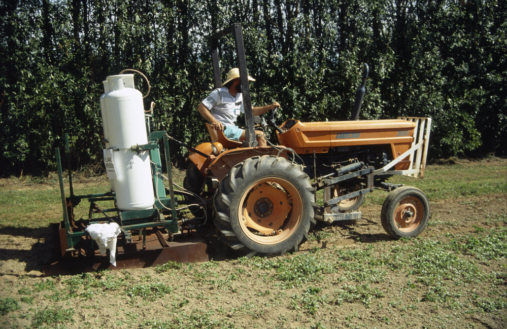 Flame weeder. 2. Tractor driven