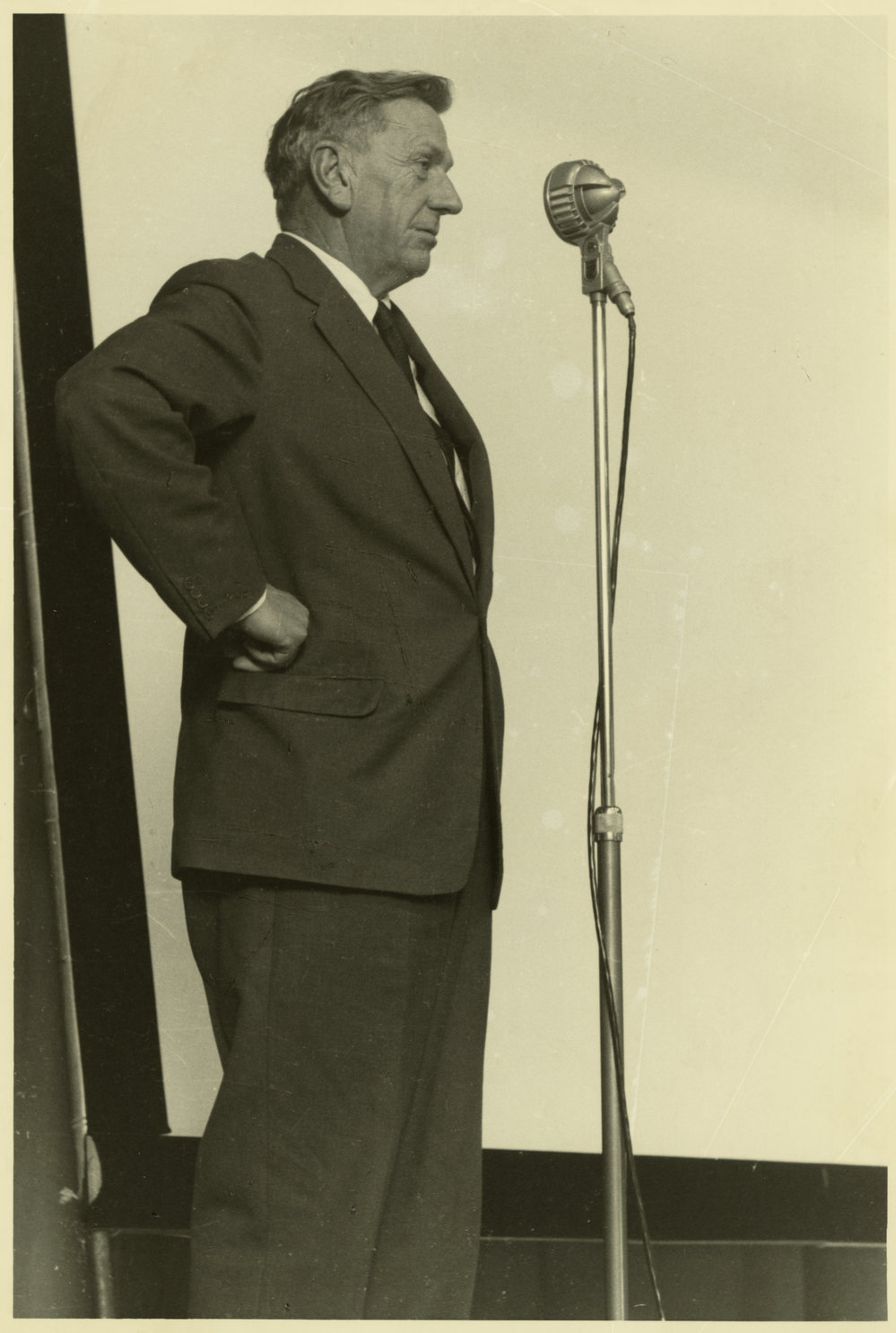 C.P. McMeekan (1908-1972) speaking on stage