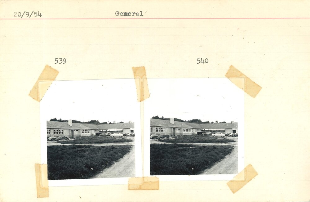 Cars outside buildings at Grasslands