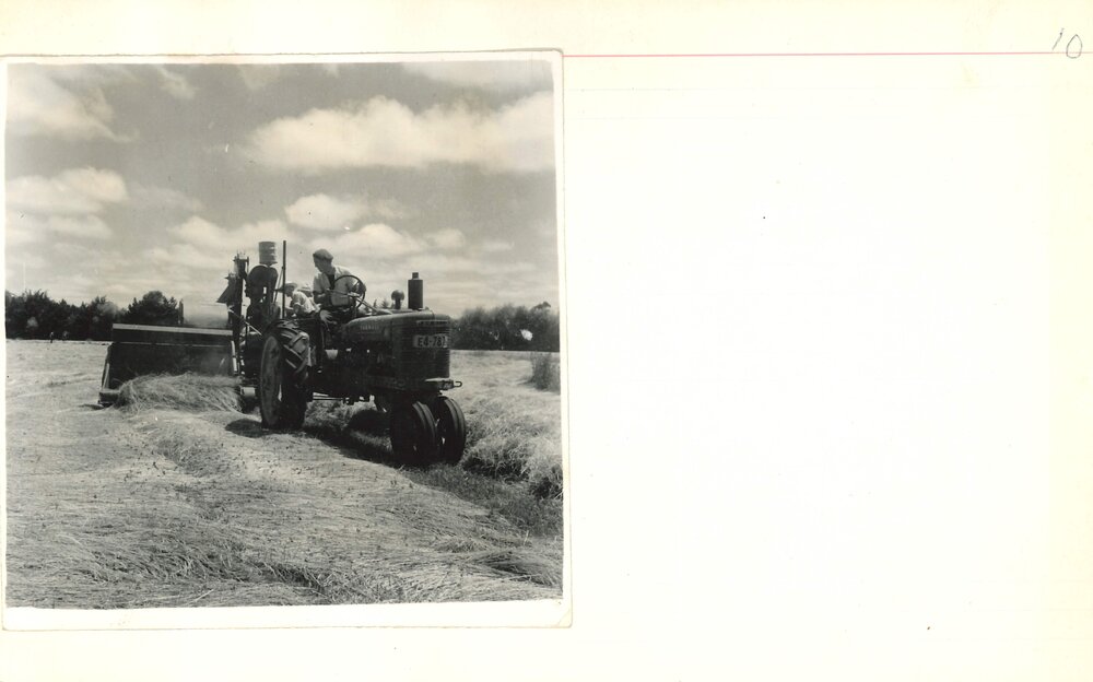 Tractor and driver working in a field