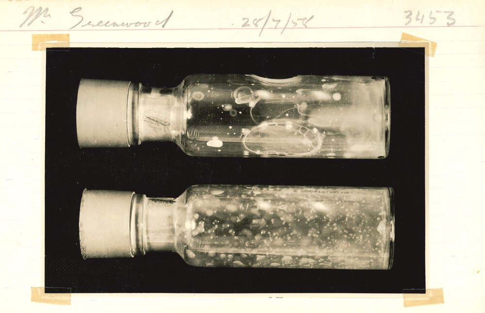 Two stoppered bottles holding an unknown substance