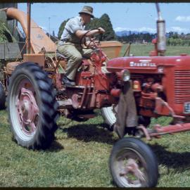 Farmall model tractor making silage