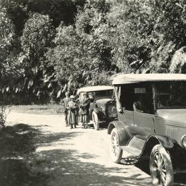 Two cars on country road