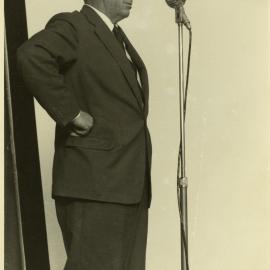 C.P. McMeekan (1908-1972) speaking on stage