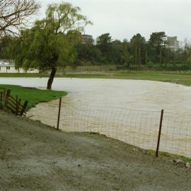 Turitea stream in flood. 2. Massey University in the background