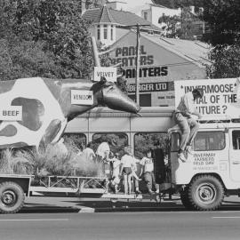 Dunedin Parade with 'Invermoose'. 1. Truck and flatbed trailer on road at a community event