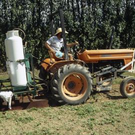 Flame weeder. 2. Tractor driven