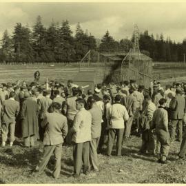Field Day attendees observing a demonstration of silage handling